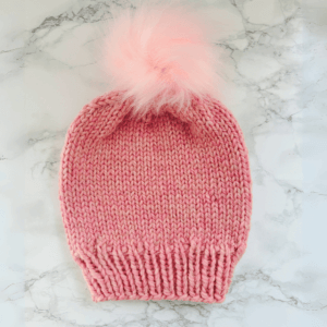 Winter beanie for kids aged 6 to 8 in a vibrant pink color